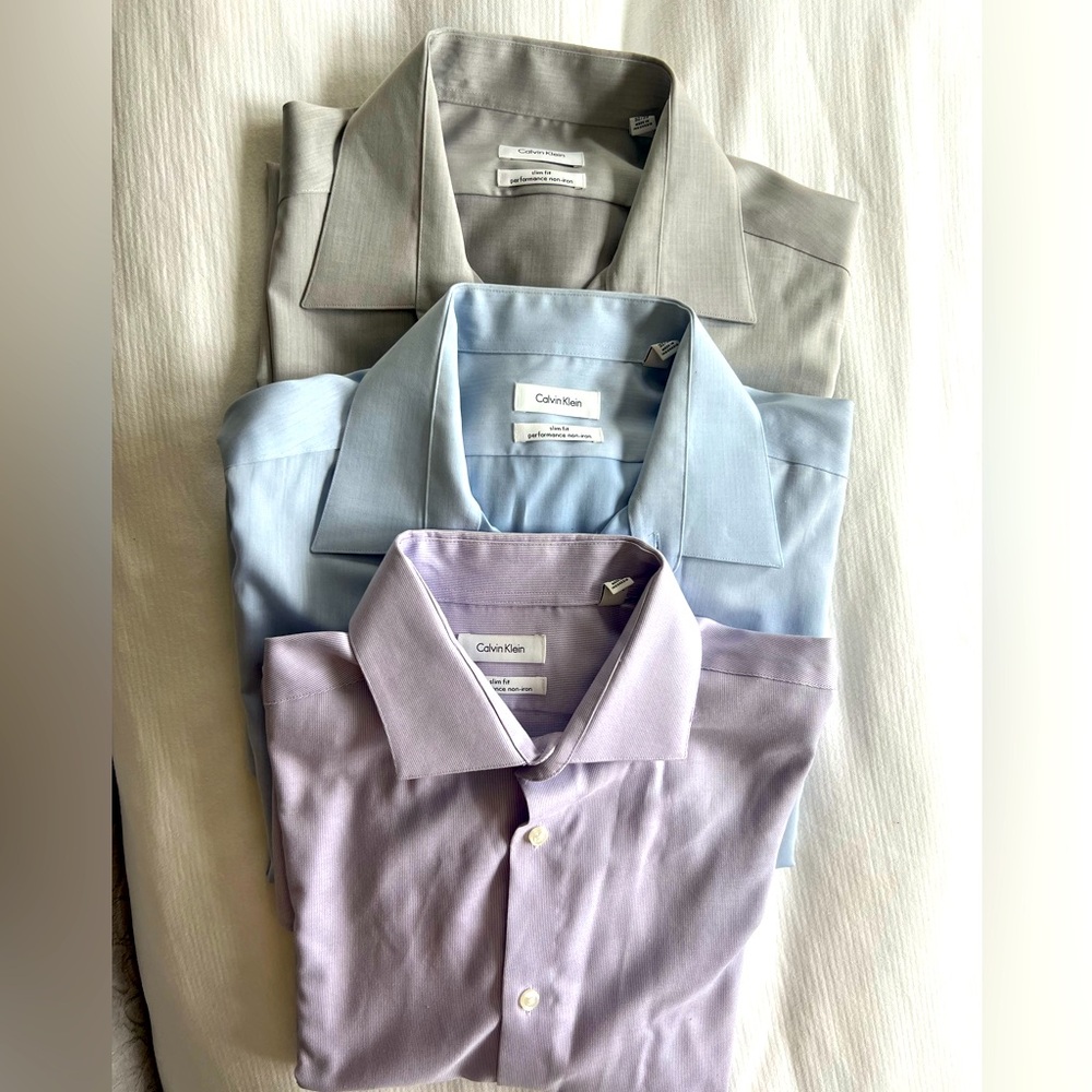 3 like new Calvin Klein dress shirts. All slim fit